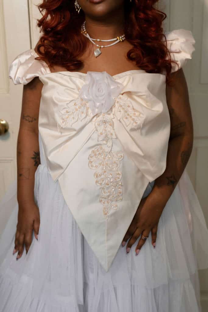 Elegant dress with floral embellishments.