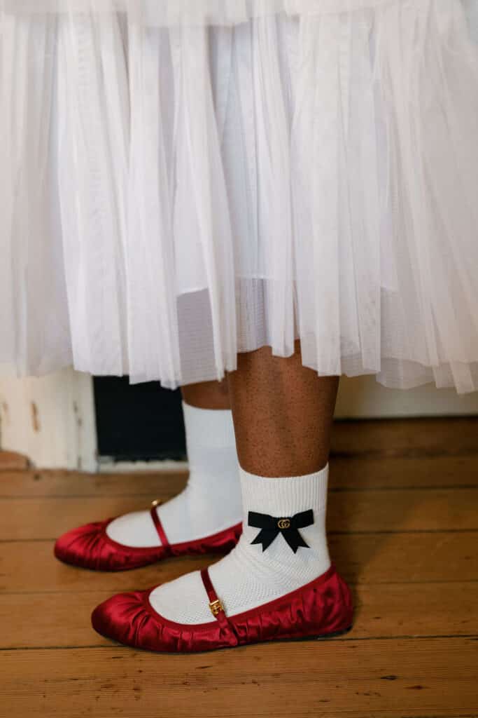 Red shoes with white tulle dress